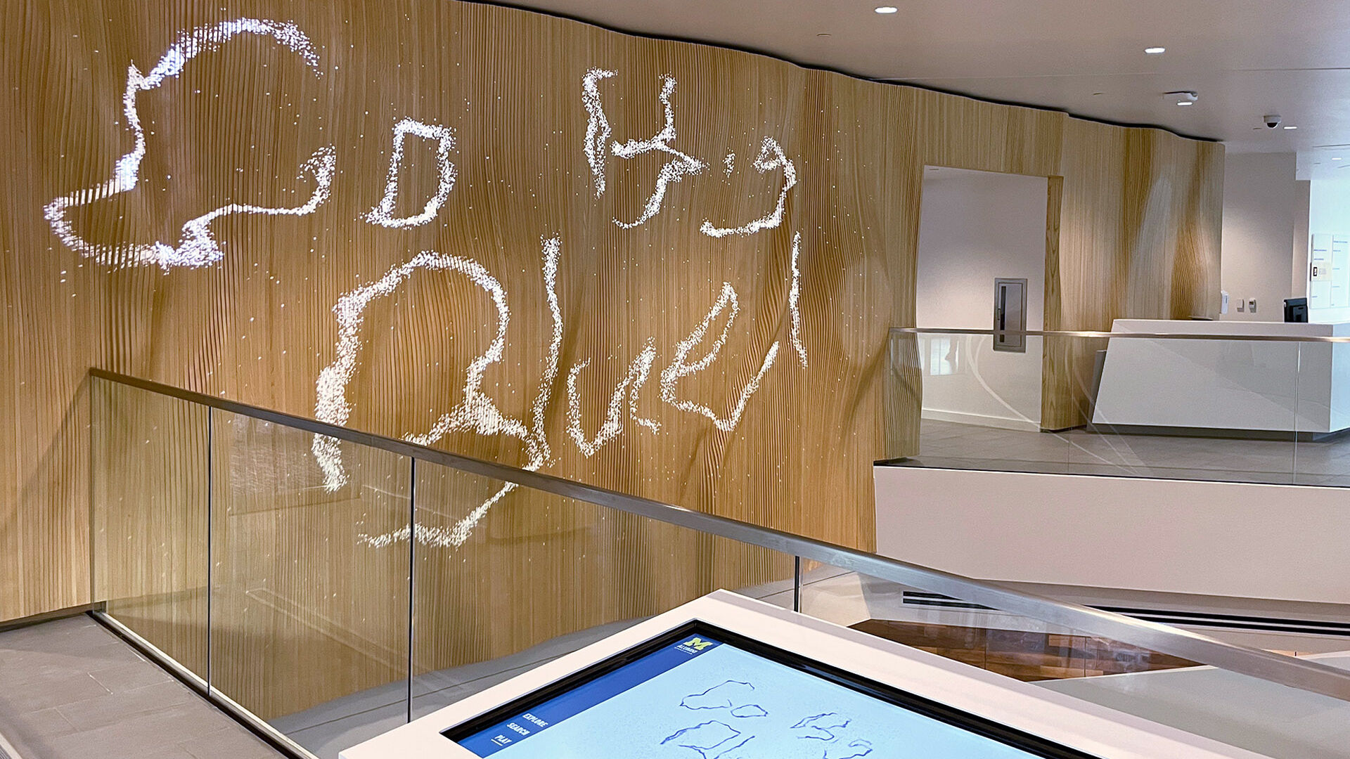 Drawing on touch table is displayed on feature wall
