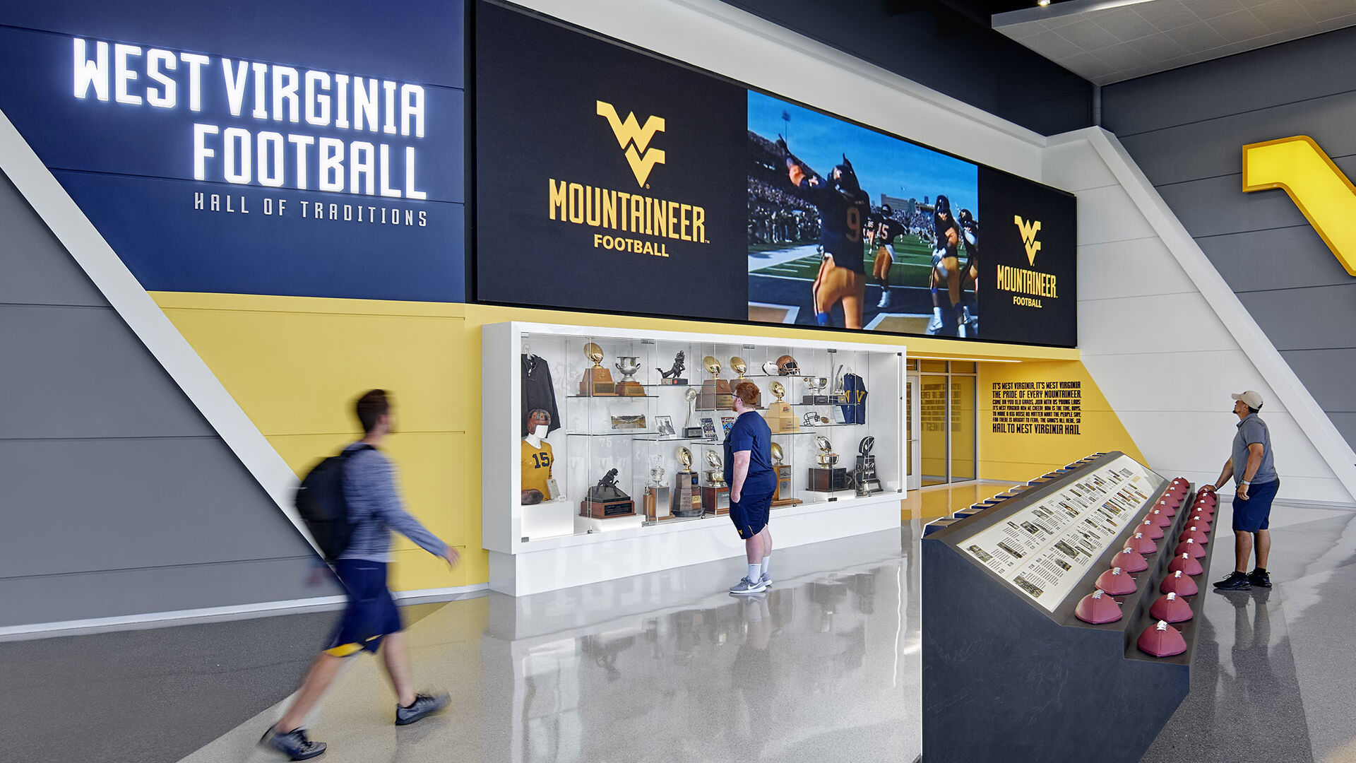 Students look at displays in the West Virginia Football Hall of Traditions